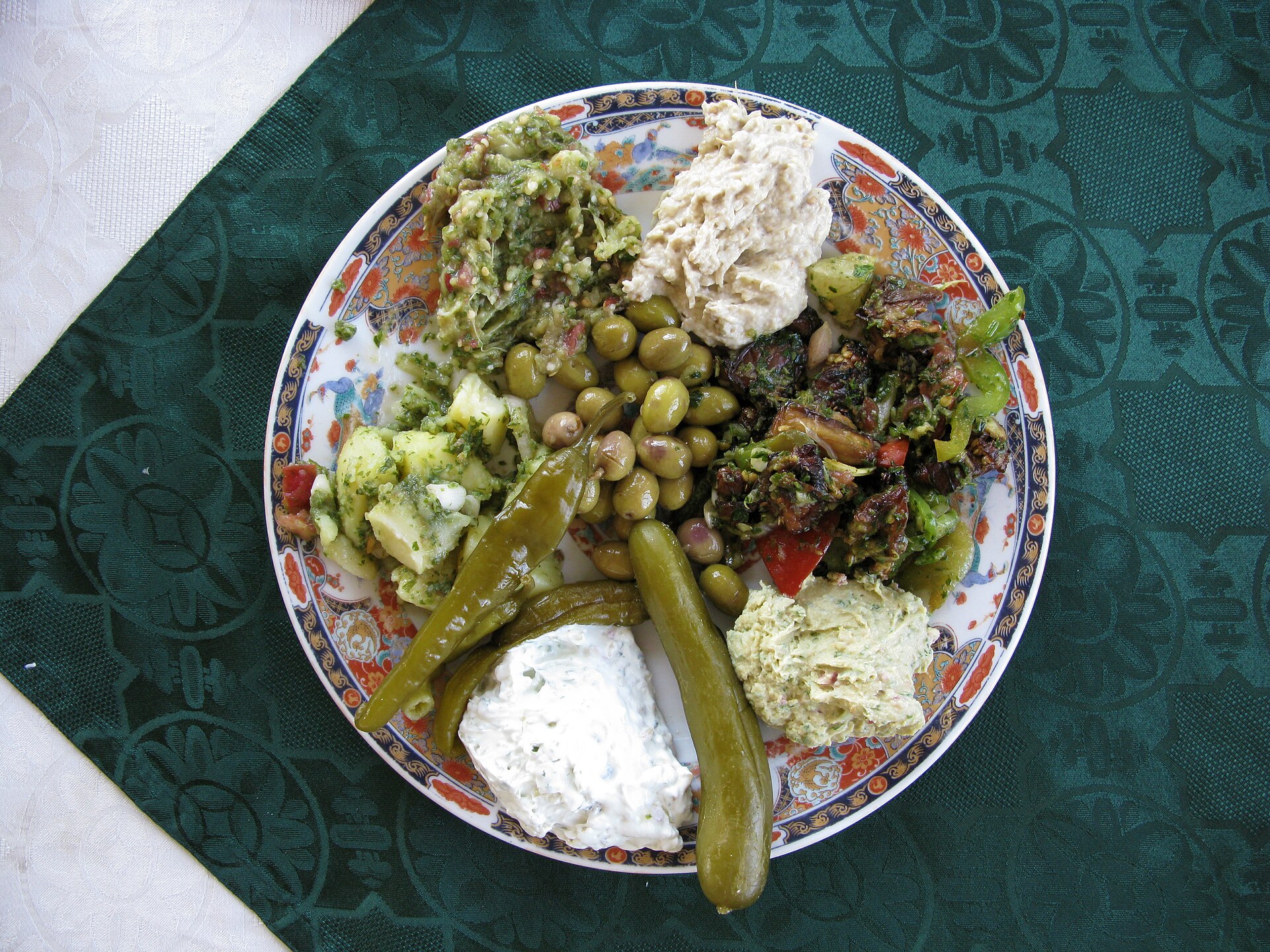 A mezze spread of small dishes served with flatbread